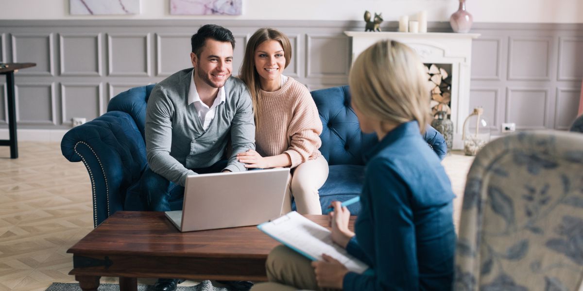 Unmarried couple reviewing legal documents with a family law solicitor, illustrating cohabitation rights and financial protection for cohabiting couples in England and Wales